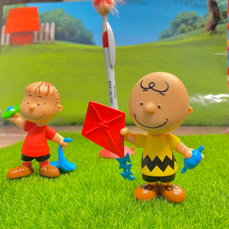 Peppy hanging out with Charlie Brown and Linus