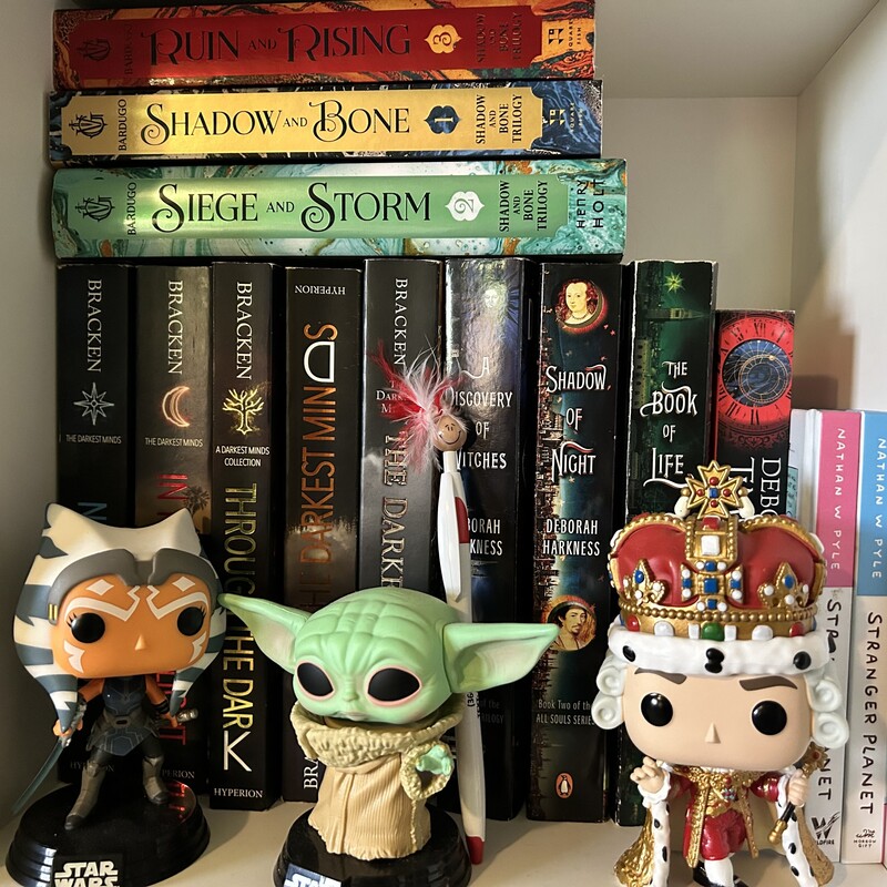 Quinn - Peppy with Star Wars and Hamilton Funko Pops and books