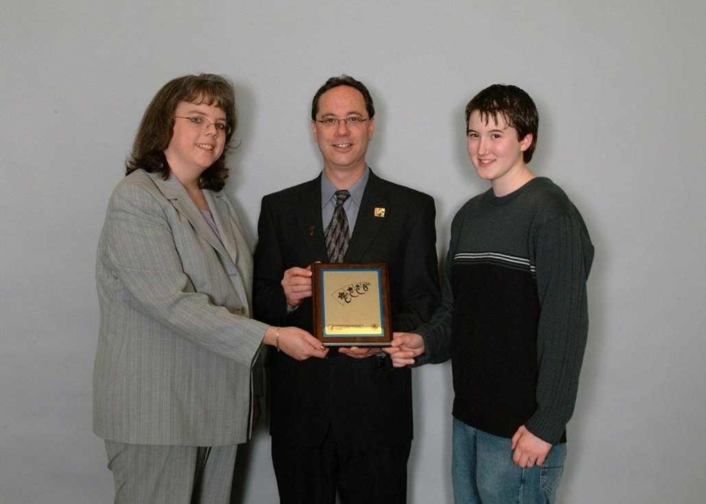 In 2004, TeenTalk received national recognition for children’s mental health communications and outreach. Program coordinator Kris Henriksen and volunteer Brandi Van Laeken accepted the award at the Winter System of Care Community Meeting in Dallas.